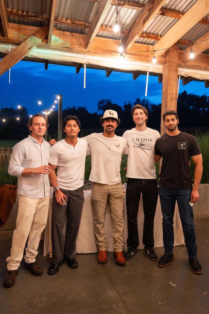 Five guys at dusk under the pavilion