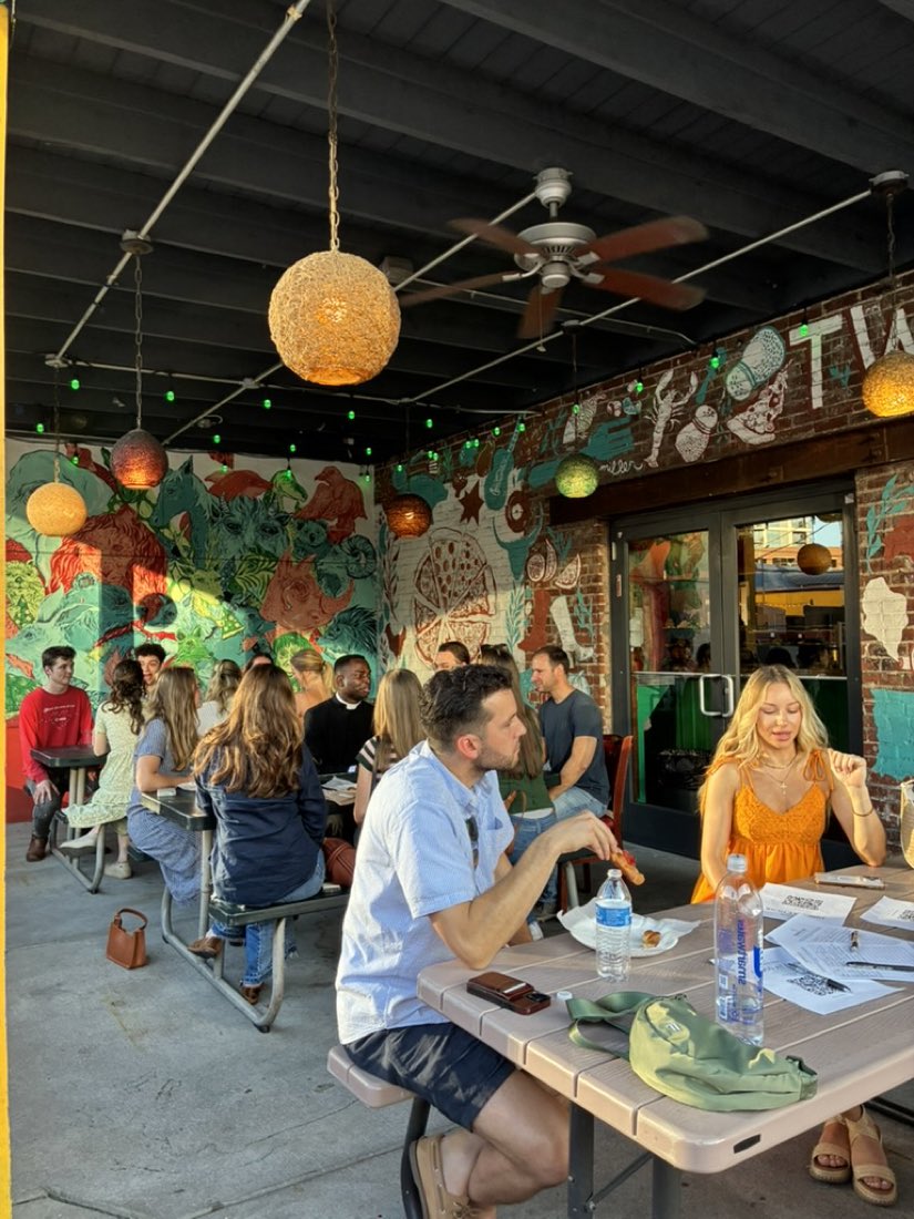 Post Mass crowd on the Two Boots patio
