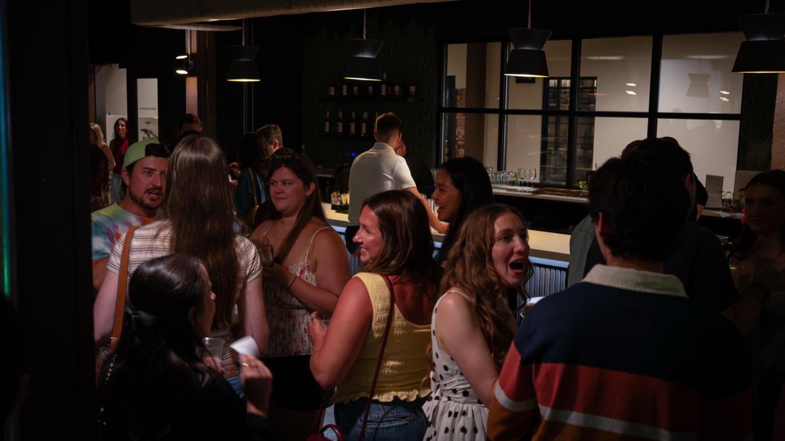 The crowd at the distillery bar during Disco at Dusk
